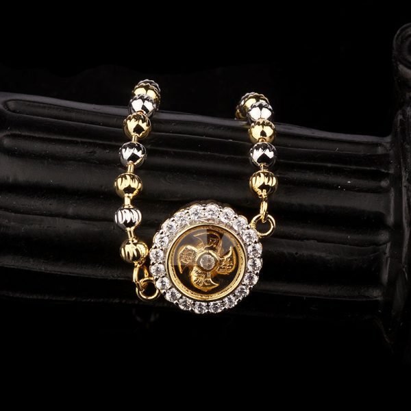 A rotating bracelet featuring symbols of prosperity and vitality, believed to bring luck and fortune to the wearer.