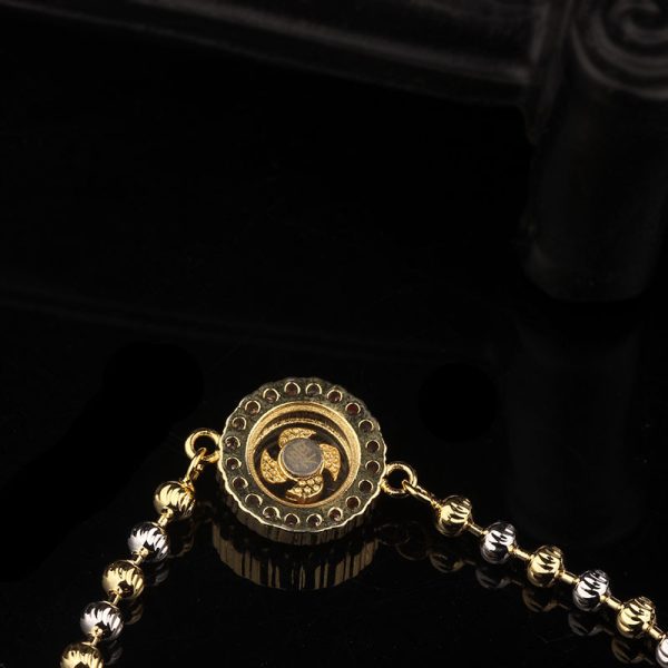 A rotating bracelet featuring symbols of prosperity and vitality, believed to bring luck and fortune to the wearer.