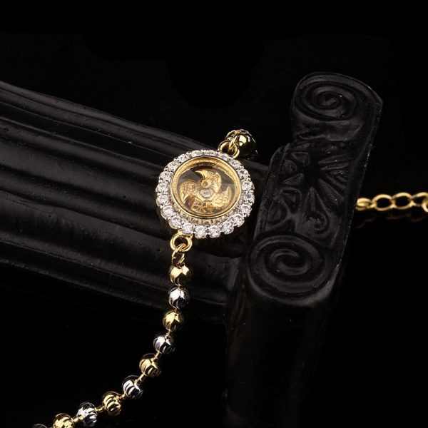 A rotating bracelet featuring symbols of prosperity and vitality, believed to bring luck and fortune to the wearer.