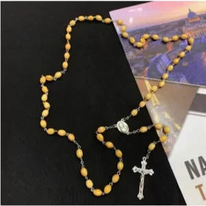 Rosary with Wooden Beads and Carved Cross Pendant: A Sacred Expression of Faith and Devotion